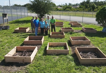 Harns Marsh and Owen Ames Kimball team in the Harns Marsh garden