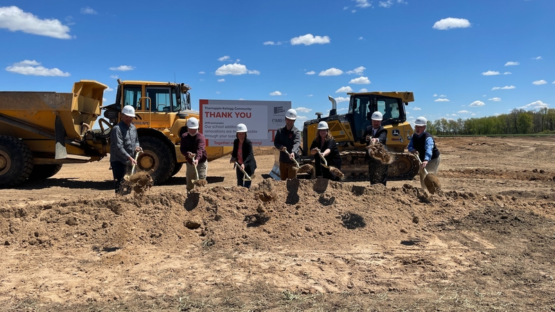 Board Members shoveling